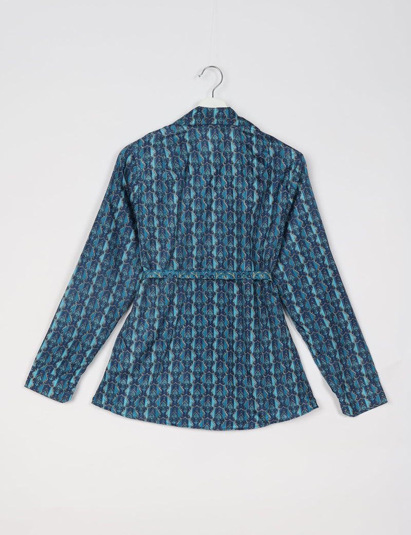 Blue Indian ethnic shirt with long sleeves, all-over intricate pattern, and back belt detail, shown hanging on white hanger