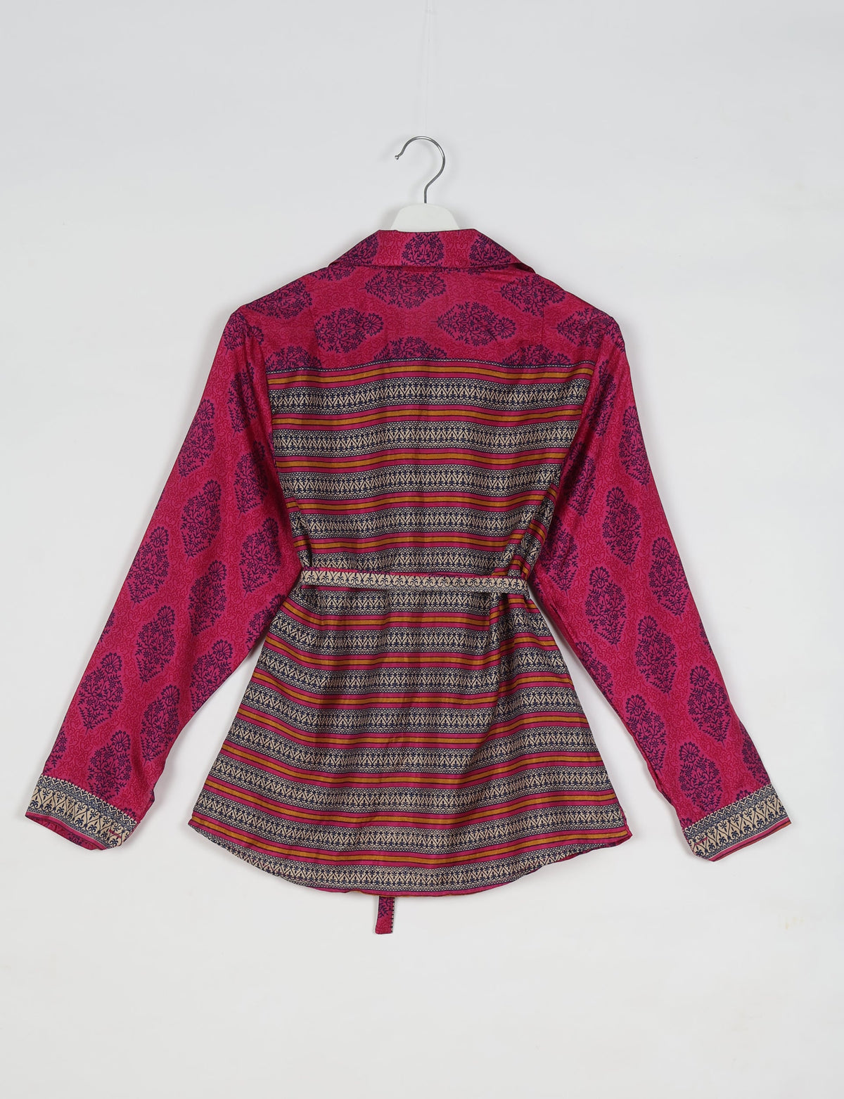 Pink Indian ethnic shirt with navy floral and striped patterns, long sleeves, collar, and back view on hanger
