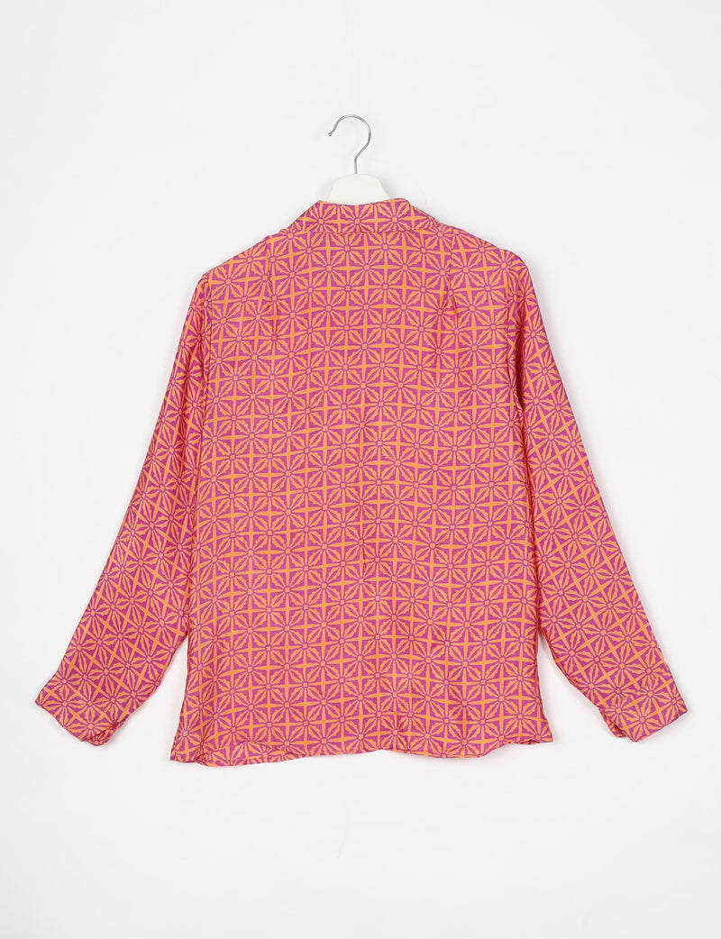 Long-sleeve shirt with pink and orange geometric leaf pattern, shown from back on white hanger against white background