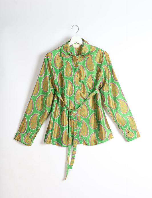 Experience sustainable fashion with our classic slim-fit shirt, crafted with ethical and green values. The shirt, designed for minimal waste, features a tie-up waist belt or neck tie, semi-spread collar, and regular shirt cuffs. Versatile and eco-friendly, wear it tucked in, unbuttoned over a tank top, or knotted at the waist for a unique style.