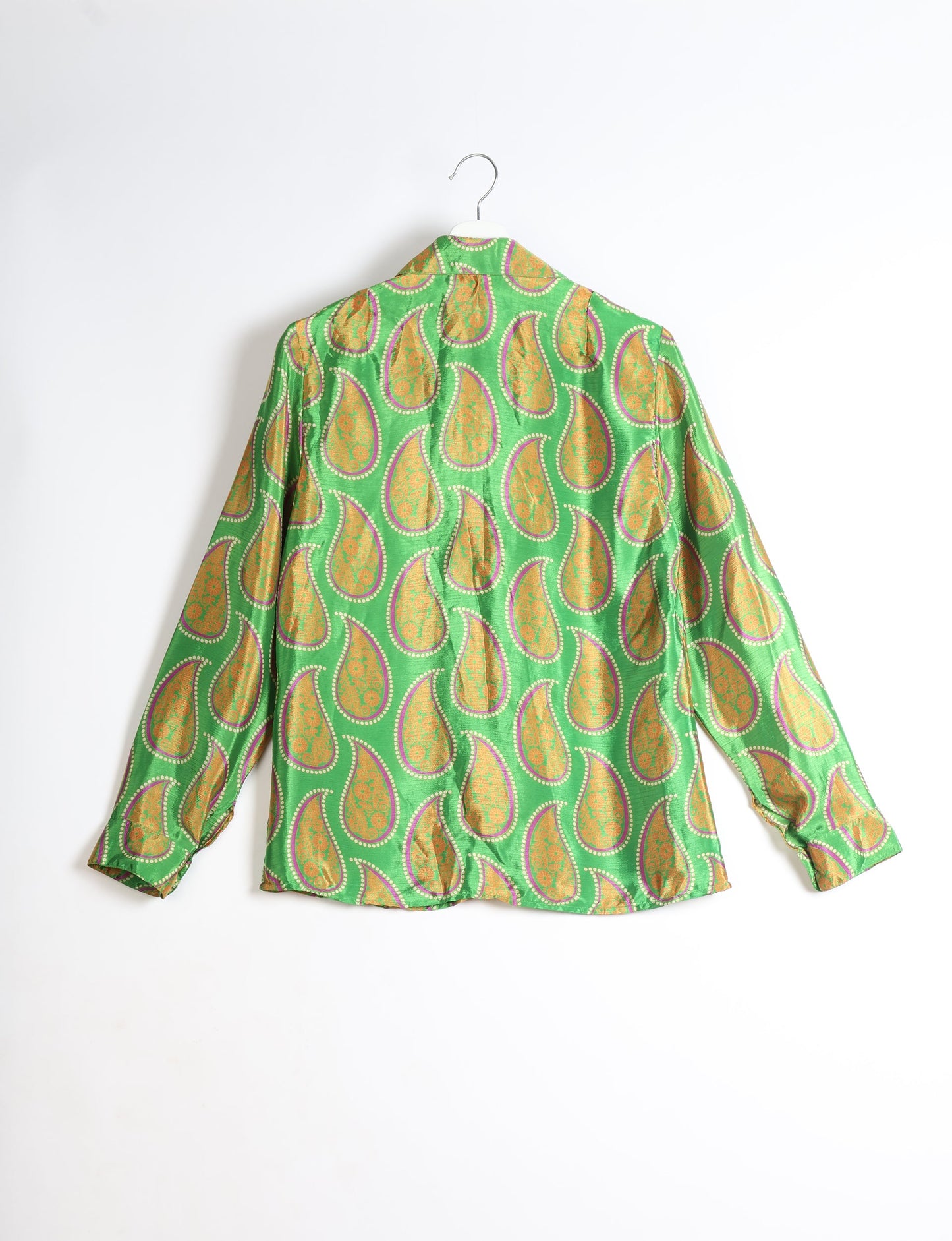 Experience sustainable fashion with our classic slim-fit shirt, crafted with ethical and green values. The shirt, designed for minimal waste, features a tie-up waist belt or neck tie, semi-spread collar, and regular shirt cuffs. Versatile and eco-friendly, wear it tucked in, unbuttoned over a tank top, or knotted at the waist for a unique style.