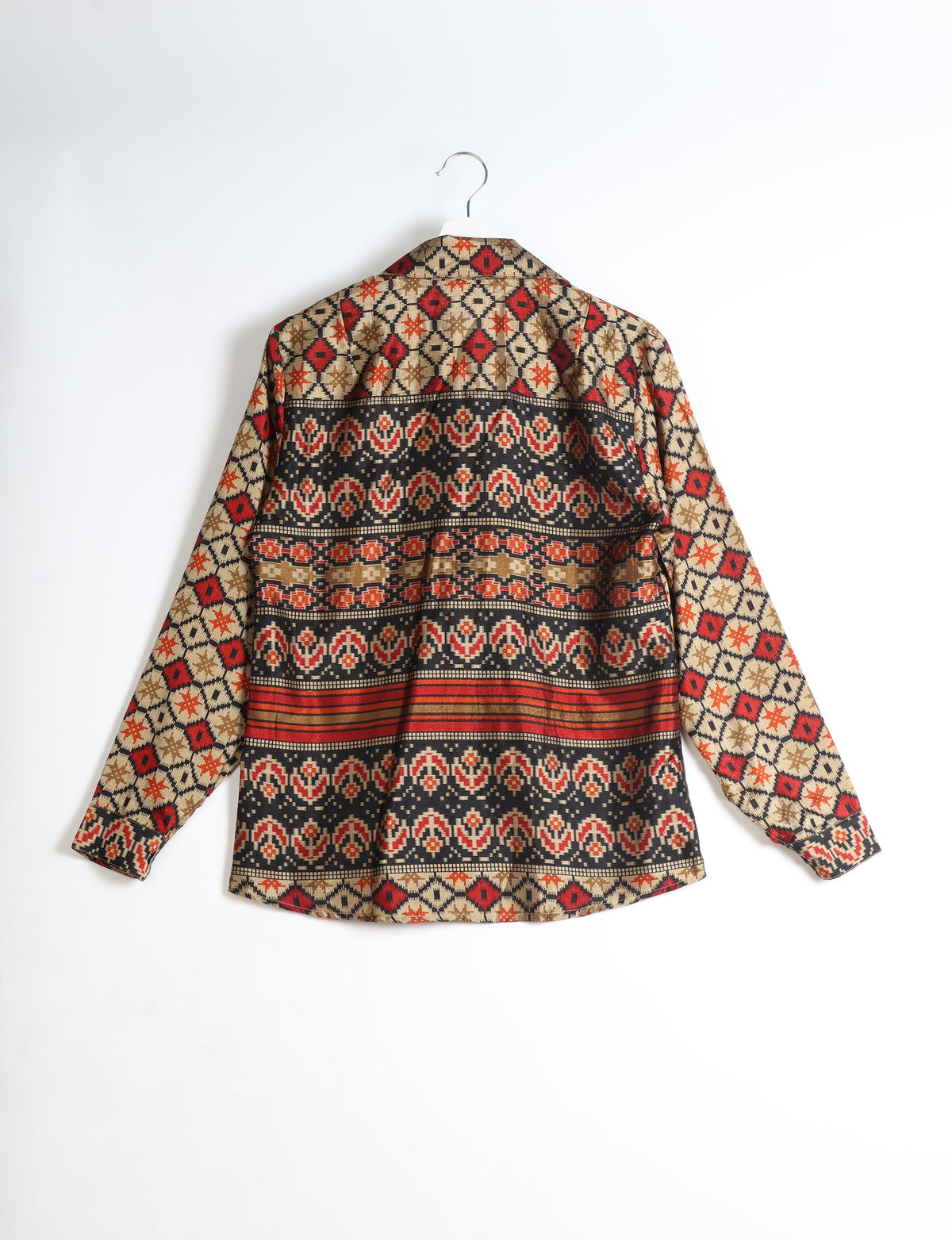 Beige long-sleeve shirt with red, black, and brown geometric and floral patterns, shown from back on hanger