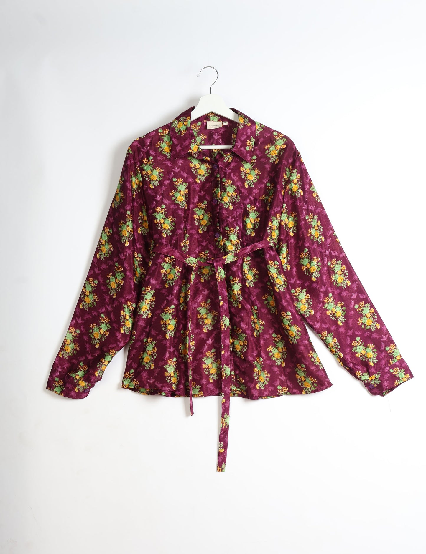 Experience sustainable fashion with our classic slim-fit shirt, crafted with ethical and green values. The shirt, designed for minimal waste, features a tie-up waist belt or neck tie, semi-spread collar, and regular shirt cuffs. Versatile and eco-friendly, wear it tucked in, unbuttoned over a tank top, or knotted at the waist for a unique style.