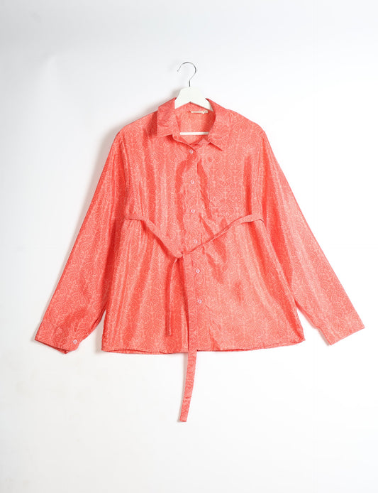 Experience sustainable fashion with our classic slim-fit shirt, crafted with ethical and green values. The shirt, designed for minimal waste, features a tie-up waist belt or neck tie, semi-spread collar, and regular shirt cuffs. Versatile and eco-friendly, wear it tucked in, unbuttoned over a tank top, or knotted at the waist for a unique style.