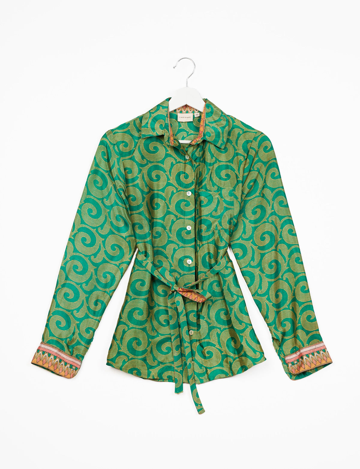 Experience sustainable fashion with our classic slim-fit shirt, crafted with ethical and green values. The shirt, designed for minimal waste, features a tie-up waist belt or neck tie, semi-spread collar, and regular shirt cuffs. Versatile and eco-friendly, wear it tucked in, unbuttoned over a tank top, or knotted at the waist for a unique style.