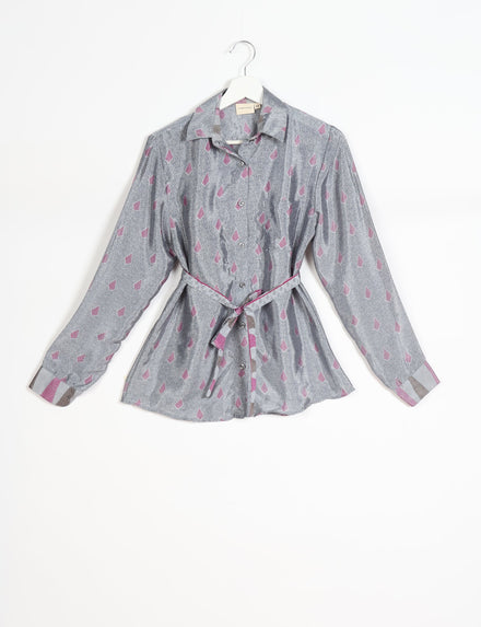 Grey long-sleeve button-up shirt with pink geometric micro design, collar, and matching fabric belt, hanging on white hanger