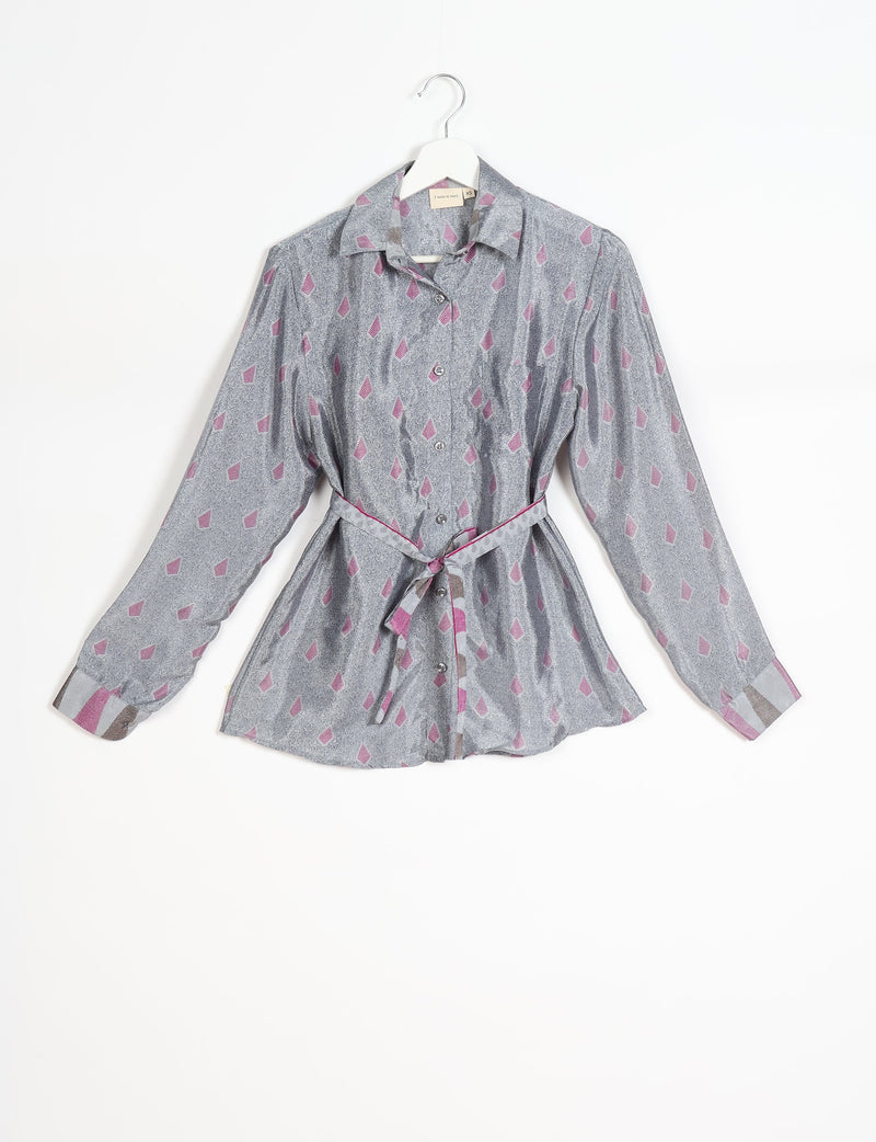 Grey long-sleeve button-up shirt with pink geometric micro design, collar, and matching fabric belt, hanging on white hanger