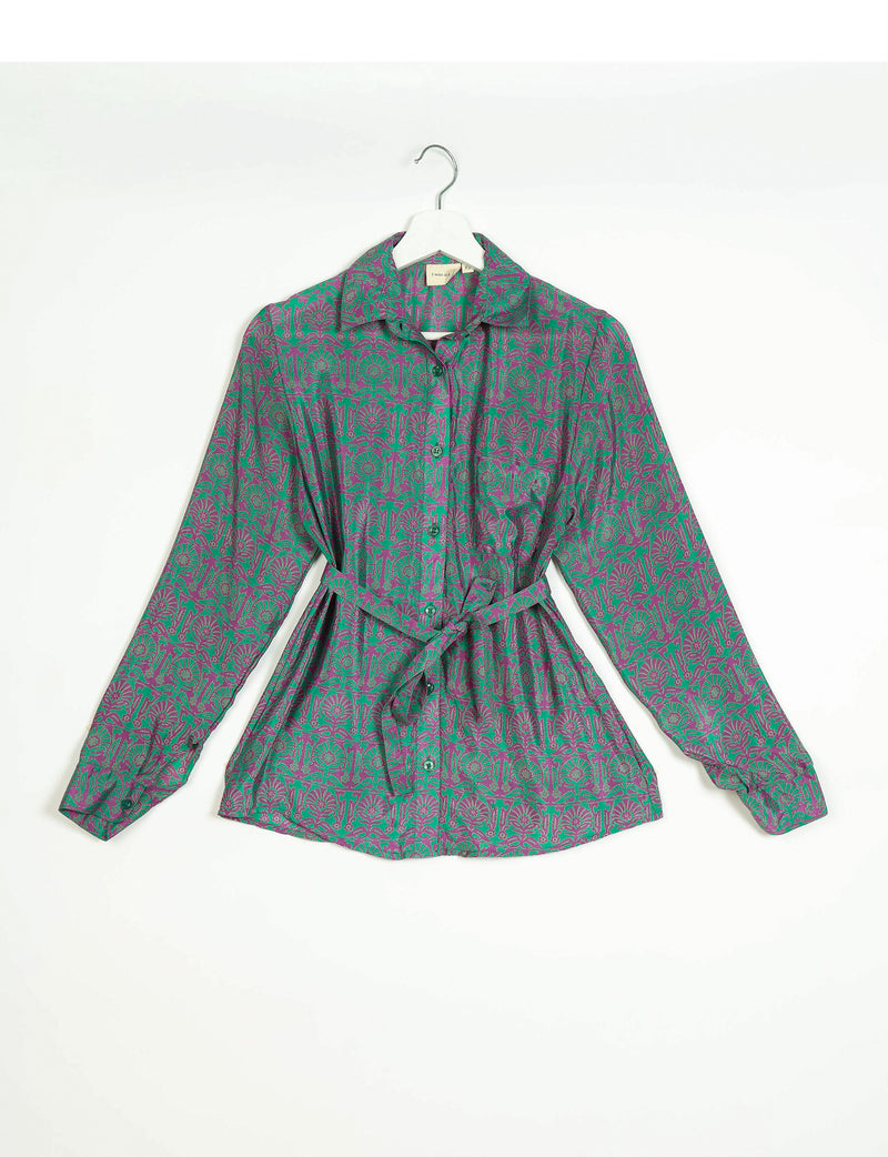 Long-sleeve button-up shirt with green and purple Indian ethnic floral pattern, collar, and waist tie, hanging on white hanger
