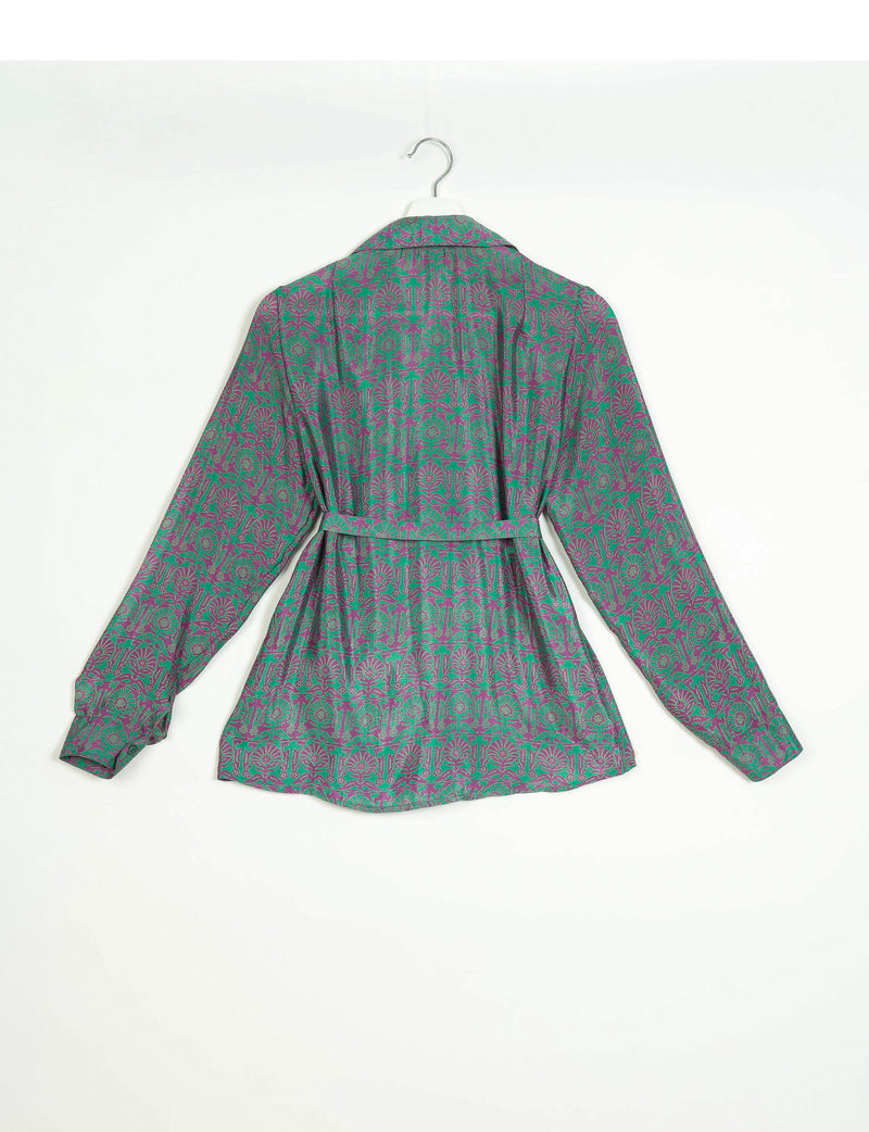 Long-sleeve shirt with green and purple Indian ethnic floral pattern, collar, and belt, shown from back on hanger