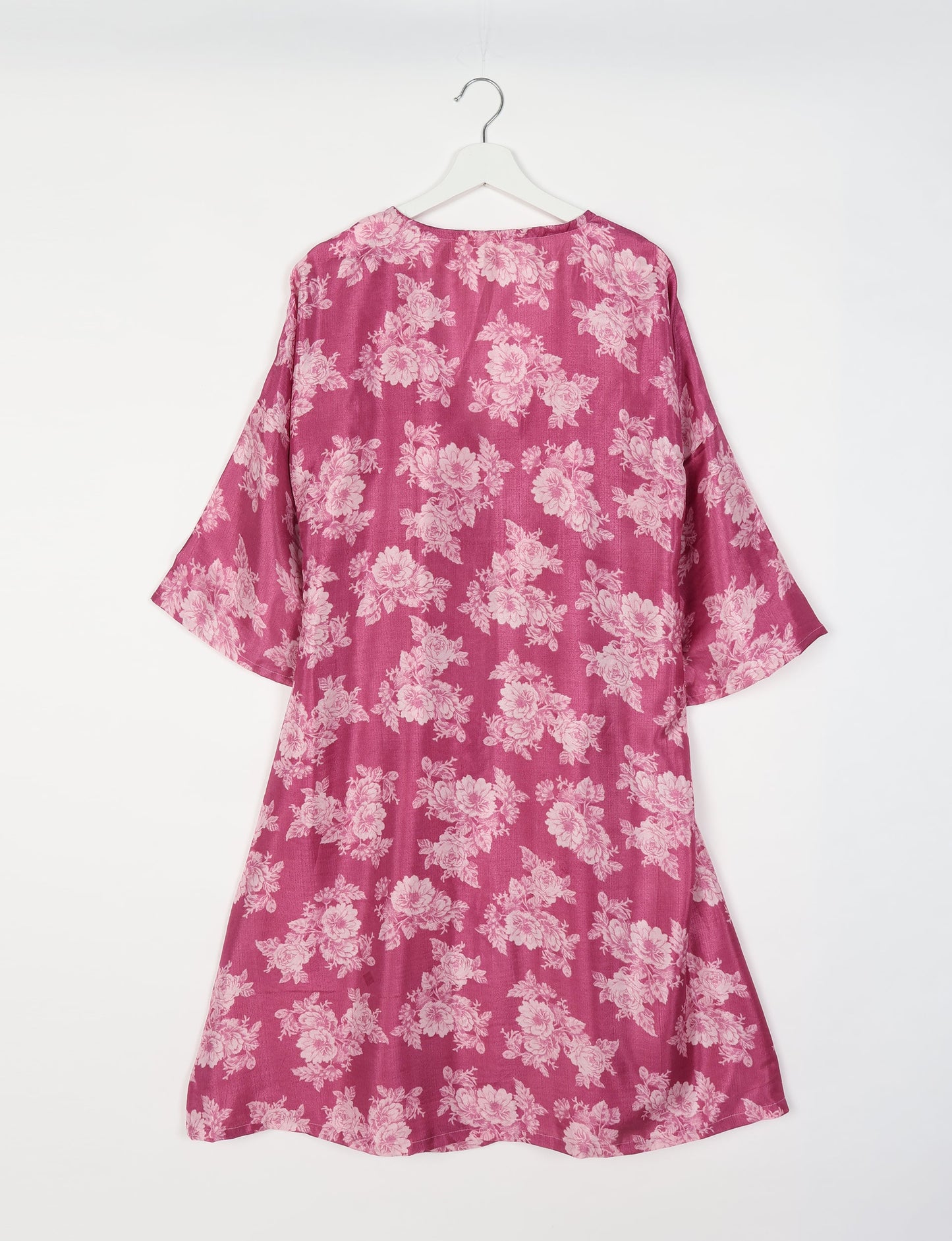 Elevate your style with our Sunset Coat, a shin-length wrap featuring a deep V-neck, wide flared 3/4 sleeves, and side tie with thread tassels. Embrace ethical and sustainable fashion with this zero waste, upcycled garment. A perfect blend of elegance and whimsy for conscious clothing enthusiasts.