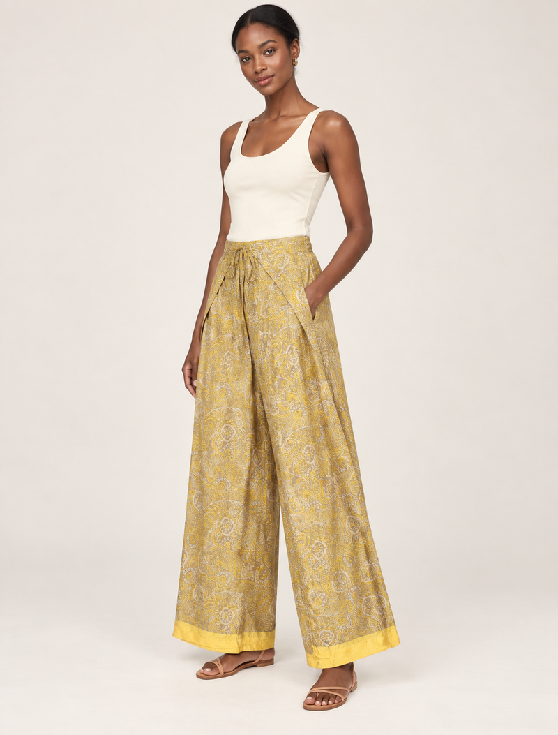 Immerse yourself in the vibrant allure of our PANTA PAREO – a distinctive piece made from handpicked, pre-worn saris, and carefully reworked by local artisans. This pareo is more than just a getaway must-have; it's a sustainable statement. Ideal as a layer over a bikini or a stylish throw, it brings eco-friendly charm to any room in your home. Embrace the colorful elegance of repurposed saris with the PANTA PAREO – an essential addition to your wardrobe for conscious and stylish living.