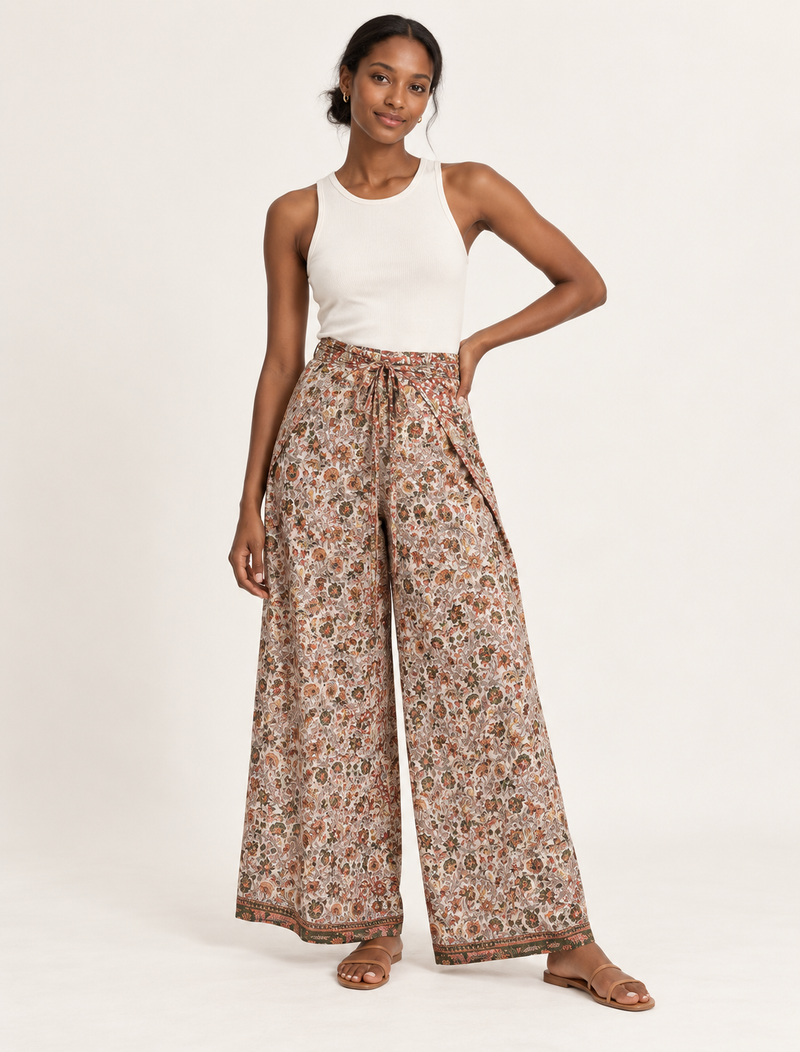 Immerse yourself in the vibrant allure of our PANTA PAREO – a distinctive piece made from handpicked, pre-worn saris, and carefully reworked by local artisans. This pareo is more than just a getaway must-have; it's a sustainable statement. Ideal as a layer over a bikini or a stylish throw, it brings eco-friendly charm to any room in your home. Embrace the colorful elegance of repurposed saris with the PANTA PAREO – an essential addition to your wardrobe for conscious and stylish living.