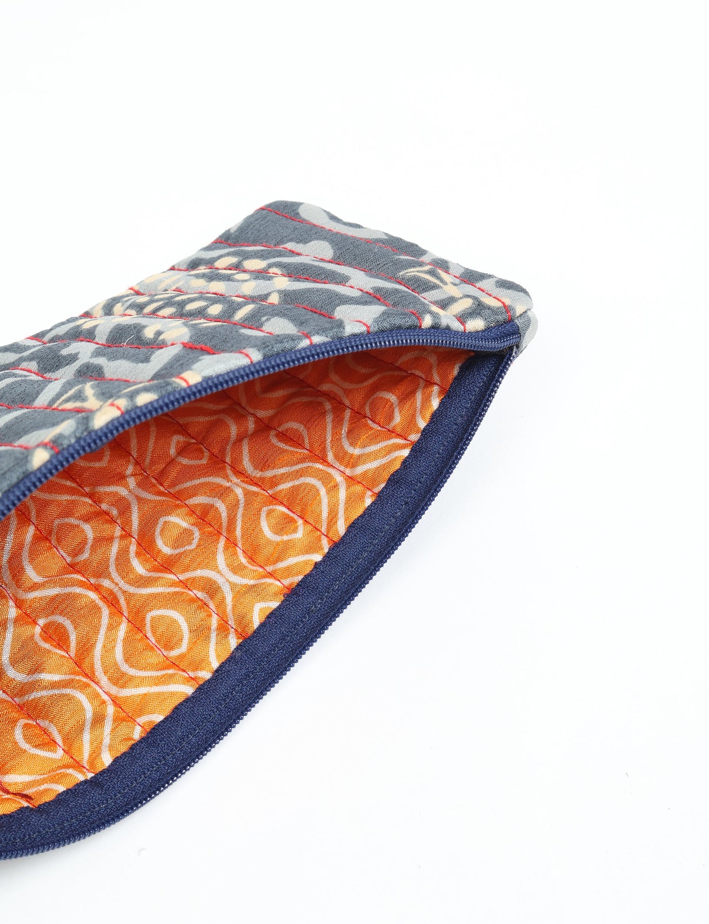 Quilted pencil pouch made from recycled clothing and repurposed textiles, promoting eco friendly fashion and circular fashion ideals. A durable, stylish storage option inspired by recycled sari products, upcycled women’s clothing, and earth friendly fashion practices.