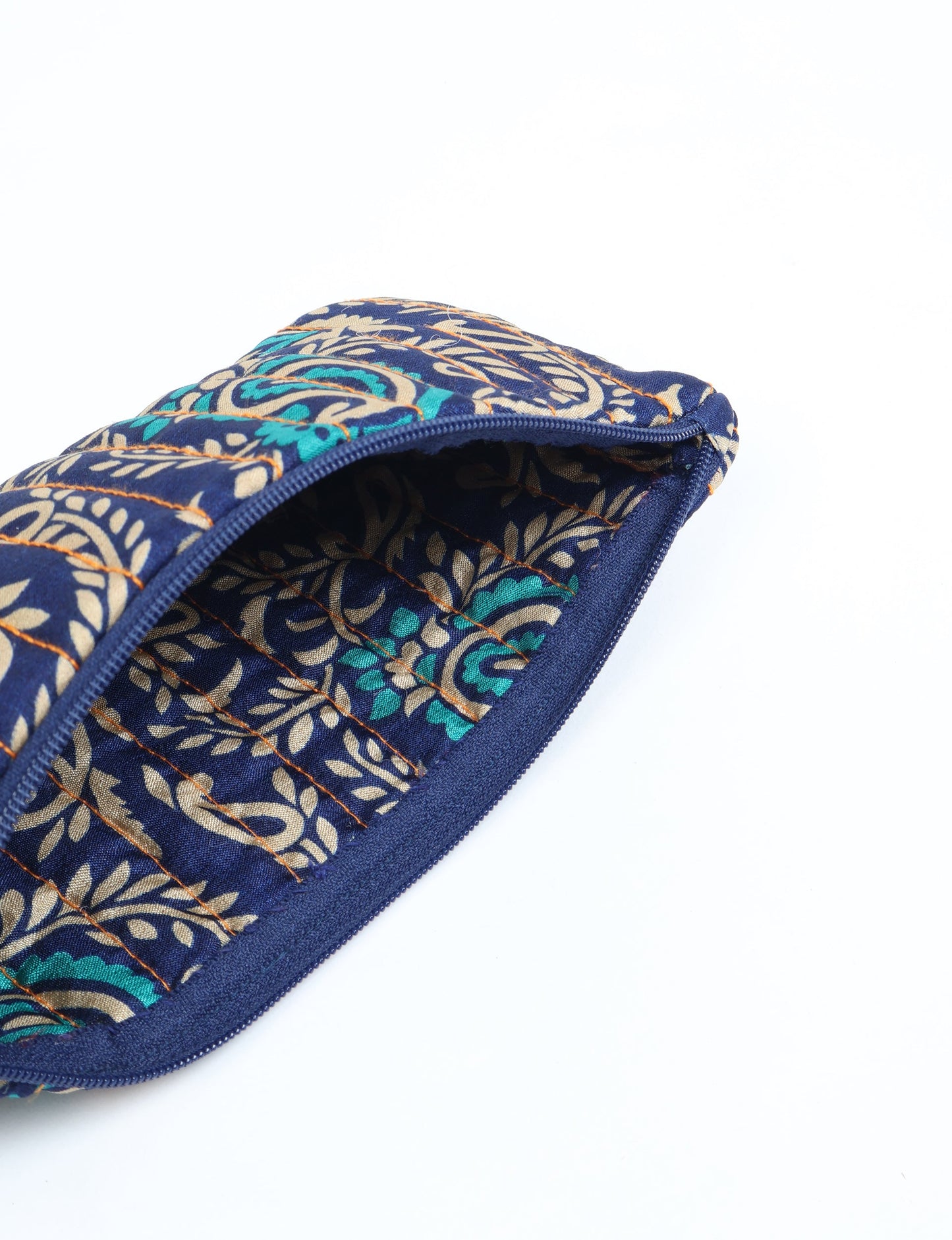 Quilted pencil pouch made from recycled clothing and repurposed textiles, promoting eco friendly fashion and circular fashion ideals. A durable, stylish storage option inspired by recycled sari products, upcycled women’s clothing, and earth friendly fashion practices.