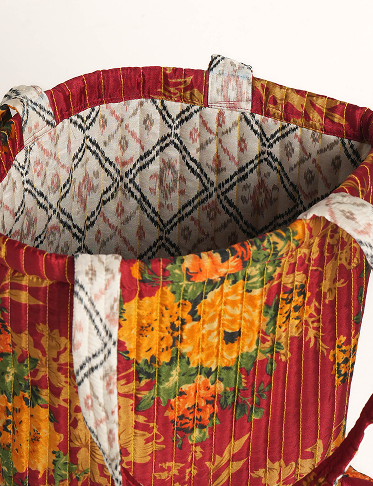 Elevate your style sustainably with our QUILTED SHOPPER BAG. Soft textures, vibrant colors, and a positive impact on people and the planet. Perfect for the office, shopping, or happy hour. Crafted from pre-loved saris for eco-conscious fashionistas!