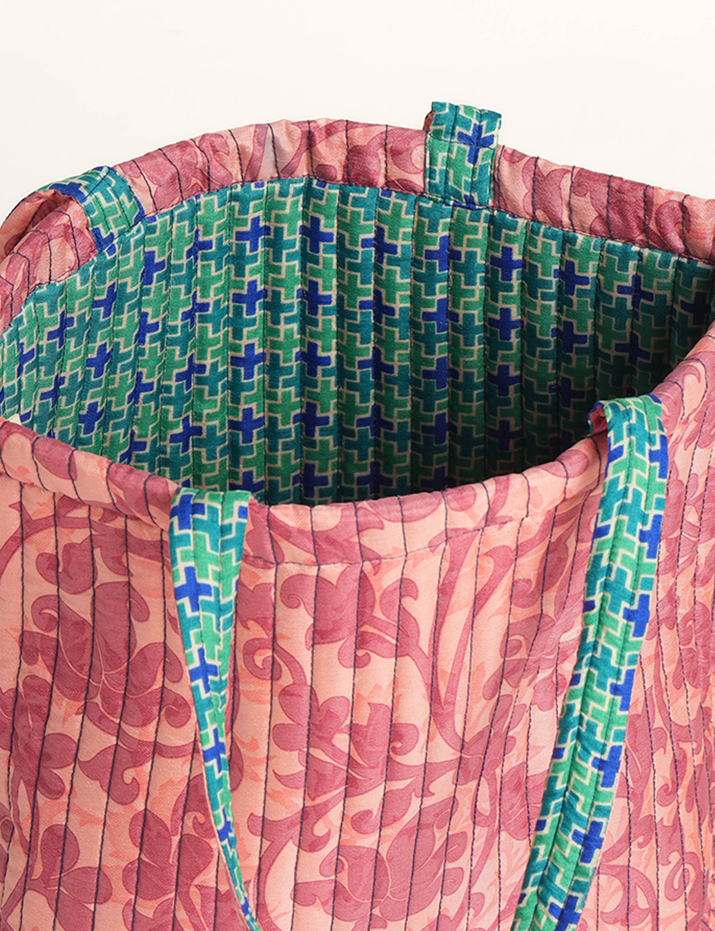 Elevate your style sustainably with our QUILTED SHOPPER BAG. Soft textures, vibrant colors, and a positive impact on people and the planet. Perfect for the office, shopping, or happy hour. Crafted from pre-loved saris for eco-conscious fashionistas!