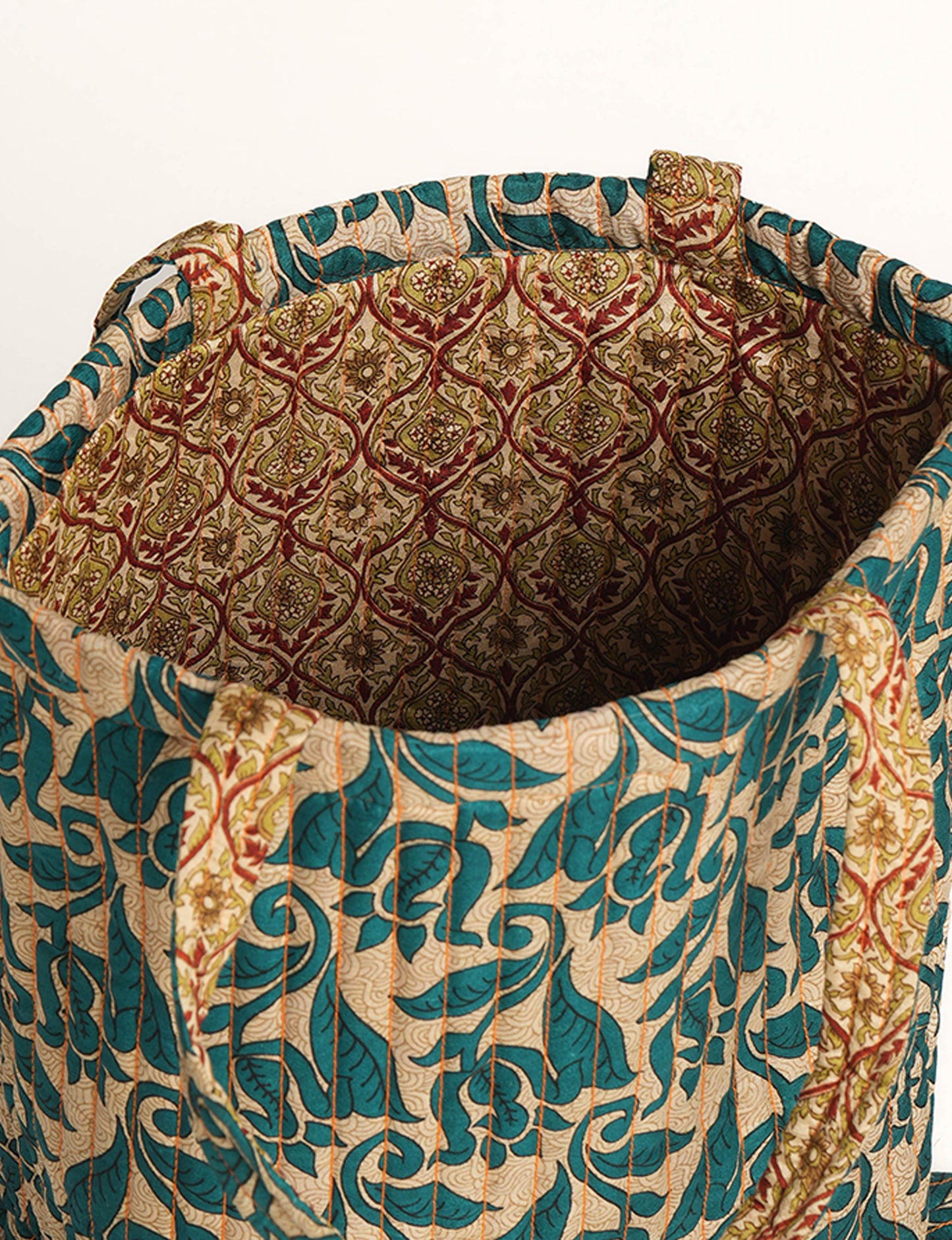 Elevate your style sustainably with our QUILTED SHOPPER BAG. Soft textures, vibrant colors, and a positive impact on people and the planet. Perfect for the office, shopping, or happy hour. Crafted from pre-loved saris for eco-conscious fashionistas!
