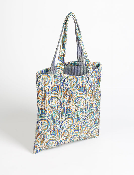 Elevate your style sustainably with our QUILTED SHOPPER BAG. Soft textures, vibrant colors, and a positive impact on people and the planet. Perfect for the office, shopping, or happy hour. Crafted from pre-loved saris for eco-conscious fashionistas!