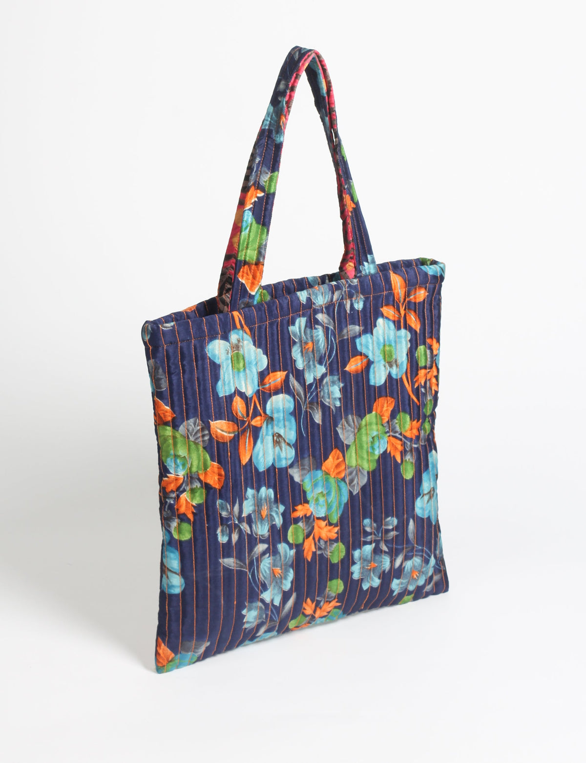 Elevate your style sustainably with our QUILTED SHOPPER BAG. Soft textures, vibrant colors, and a positive impact on people and the planet. Perfect for the office, shopping, or happy hour. Crafted from pre-loved saris for eco-conscious fashionistas!