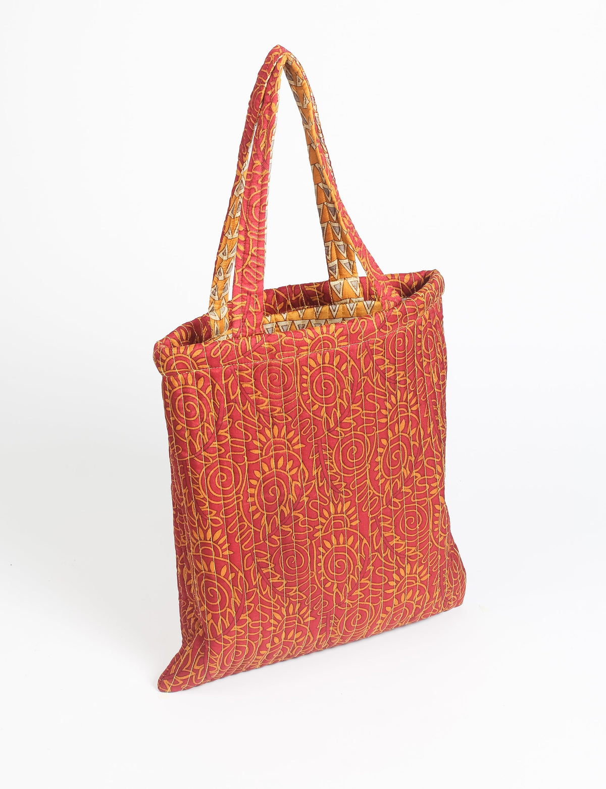 Elevate your style sustainably with our QUILTED SHOPPER BAG. Soft textures, vibrant colors, and a positive impact on people and the planet. Perfect for the office, shopping, or happy hour. Crafted from pre-loved saris for eco-conscious fashionistas!