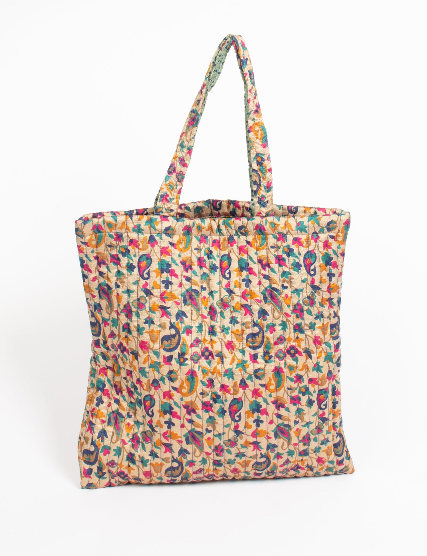 Elevate your style sustainably with our QUILTED SHOPPER BAG. Soft textures, vibrant colors, and a positive impact on people and the planet. Perfect for the office, shopping, or happy hour. Crafted from pre-loved saris for eco-conscious fashionistas!