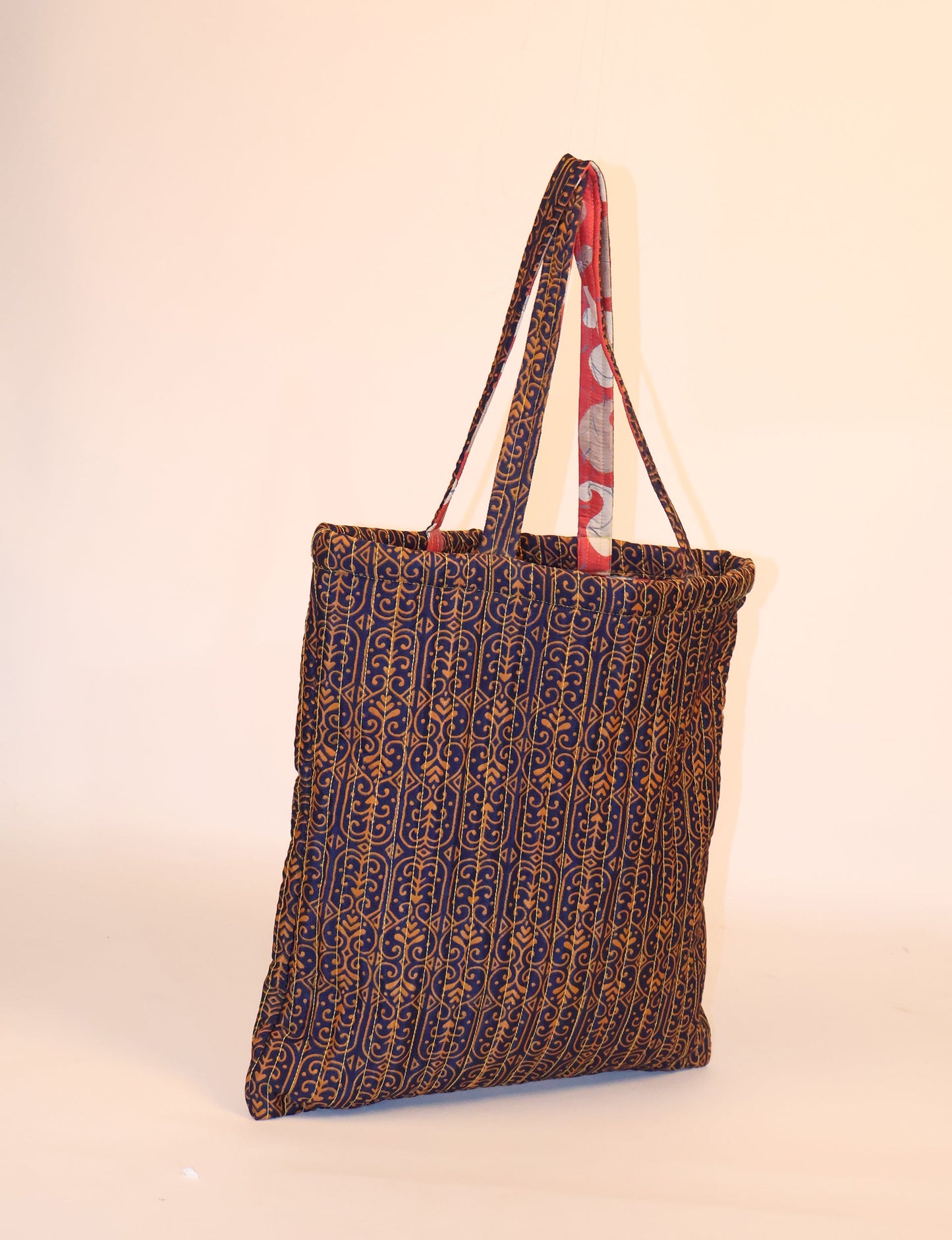 Elevate your style sustainably with our QUILTED SHOPPER BAG. Soft textures, vibrant colors, and a positive impact on people and the planet. Perfect for the office, shopping, or happy hour. Crafted from pre-loved saris for eco-conscious fashionistas!