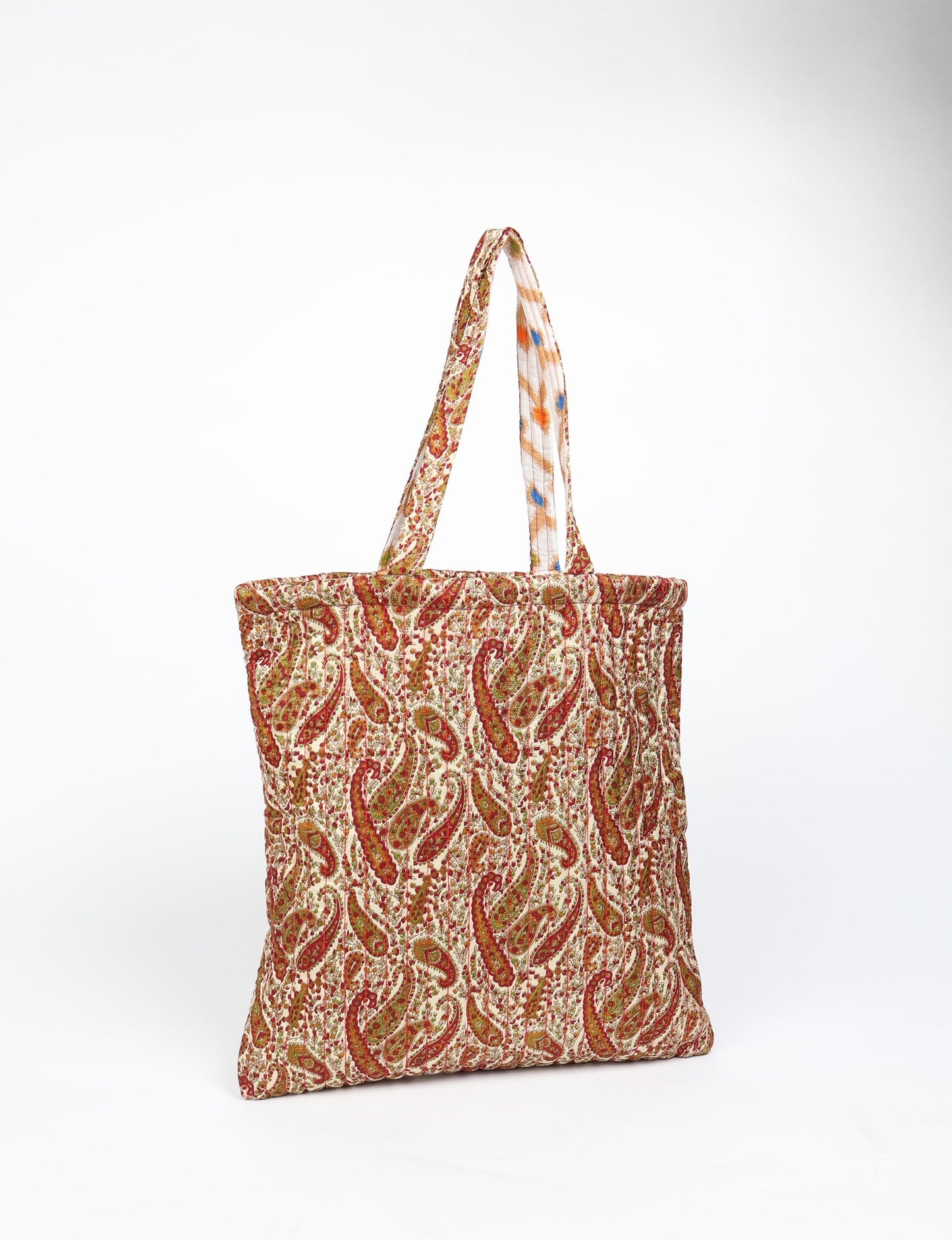 Elevate your style sustainably with our QUILTED SHOPPER BAG. Soft textures, vibrant colors, and a positive impact on people and the planet. Perfect for the office, shopping, or happy hour. Crafted from pre-loved saris for eco-conscious fashionistas!