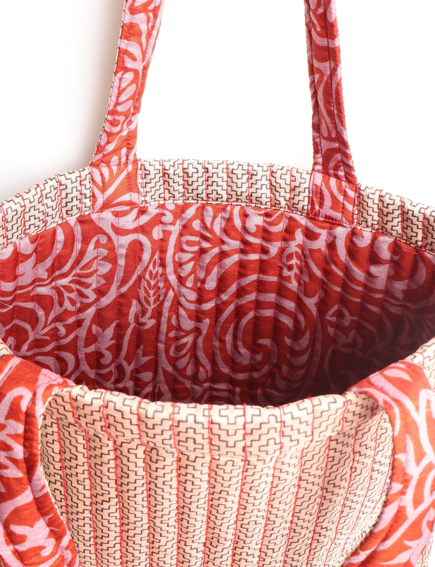 Elevate your style sustainably with our QUILTED SHOPPER BAG. Soft textures, vibrant colors, and a positive impact on people and the planet. Perfect for the office, shopping, or happy hour. Crafted from pre-loved saris for eco-conscious fashionistas!