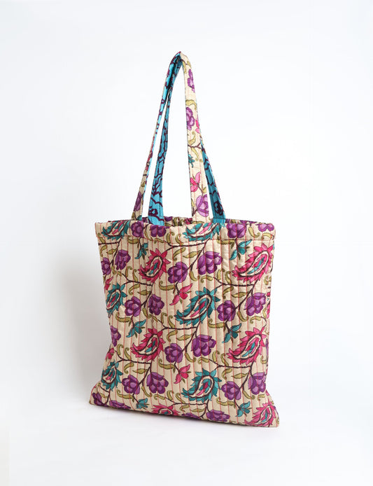 Elevate your style sustainably with our QUILTED SHOPPER BAG. Soft textures, vibrant colors, and a positive impact on people and the planet. Perfect for the office, shopping, or happy hour. Crafted from pre-loved saris for eco-conscious fashionistas!