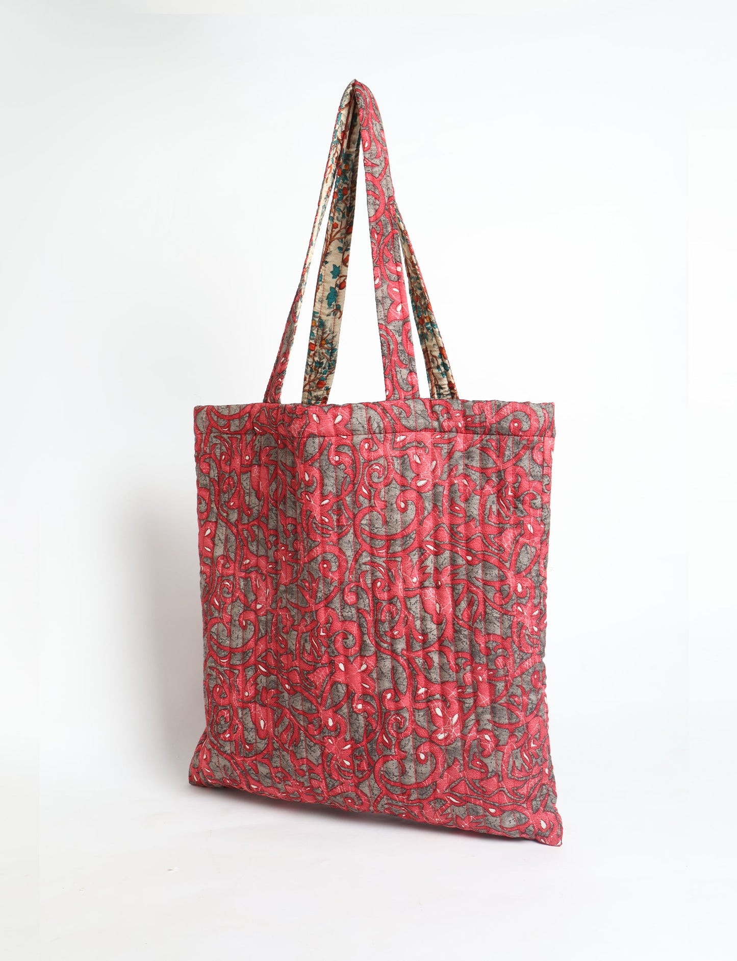 Elevate your style sustainably with our QUILTED SHOPPER BAG. Soft textures, vibrant colors, and a positive impact on people and the planet. Perfect for the office, shopping, or happy hour. Crafted from pre-loved saris for eco-conscious fashionistas!