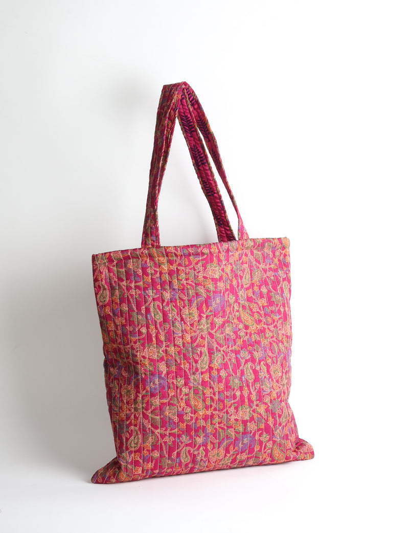 Elevate your style sustainably with our QUILTED SHOPPER BAG. Soft textures, vibrant colors, and a positive impact on people and the planet. Perfect for the office, shopping, or happy hour. Crafted from pre-loved saris for eco-conscious fashionistas!