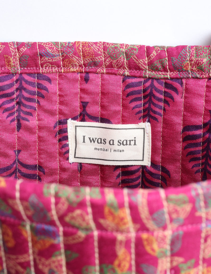 Elevate your style sustainably with our QUILTED SHOPPER BAG. Soft textures, vibrant colors, and a positive impact on people and the planet. Perfect for the office, shopping, or happy hour. Crafted from pre-loved saris for eco-conscious fashionistas!