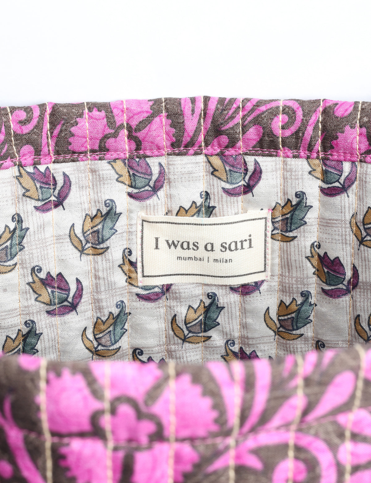 Elevate your style sustainably with our QUILTED SHOPPER BAG. Soft textures, vibrant colors, and a positive impact on people and the planet. Perfect for the office, shopping, or happy hour. Crafted from pre-loved saris for eco-conscious fashionistas!