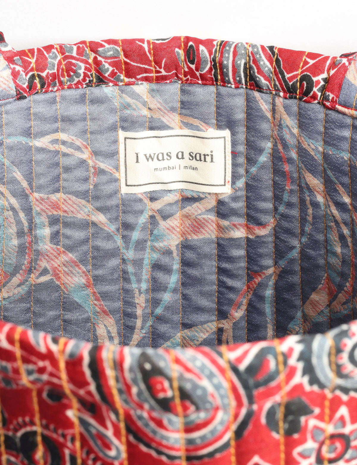 Elevate your style sustainably with our QUILTED SHOPPER BAG. Soft textures, vibrant colors, and a positive impact on people and the planet. Perfect for the office, shopping, or happy hour. Crafted from pre-loved saris for eco-conscious fashionistas!