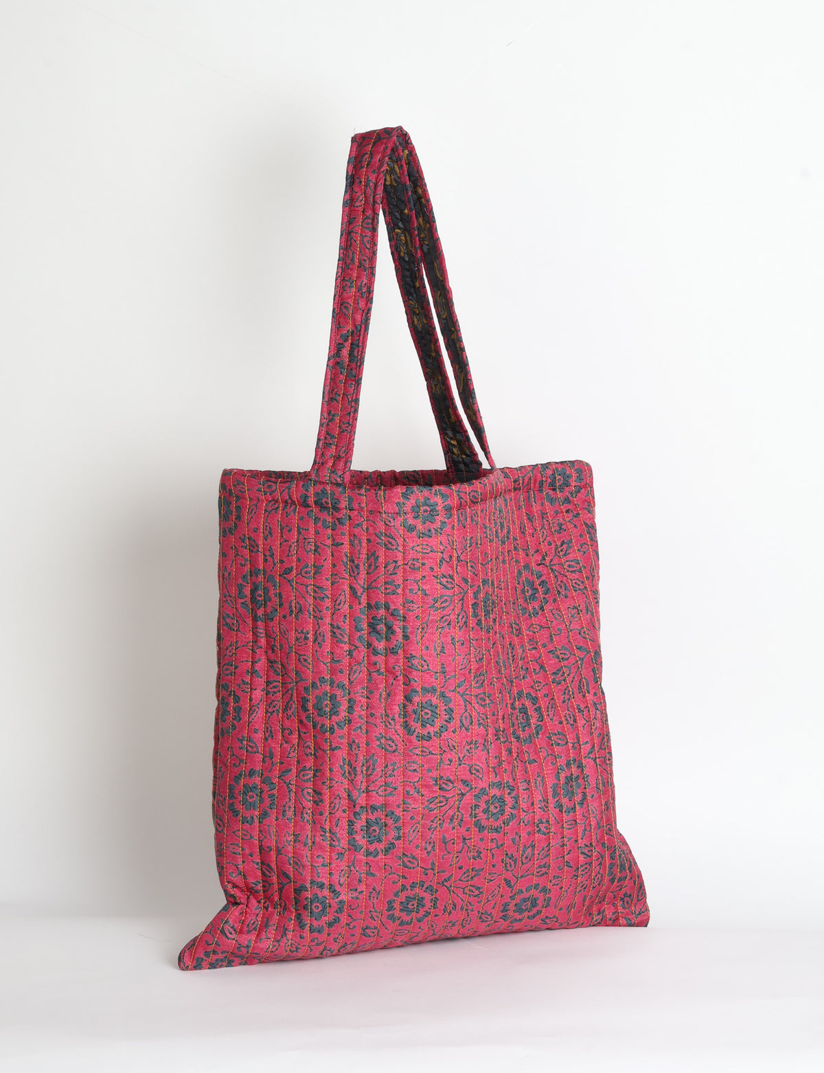 Elevate your style sustainably with our QUILTED SHOPPER BAG. Soft textures, vibrant colors, and a positive impact on people and the planet. Perfect for the office, shopping, or happy hour. Crafted from pre-loved saris for eco-conscious fashionistas!
