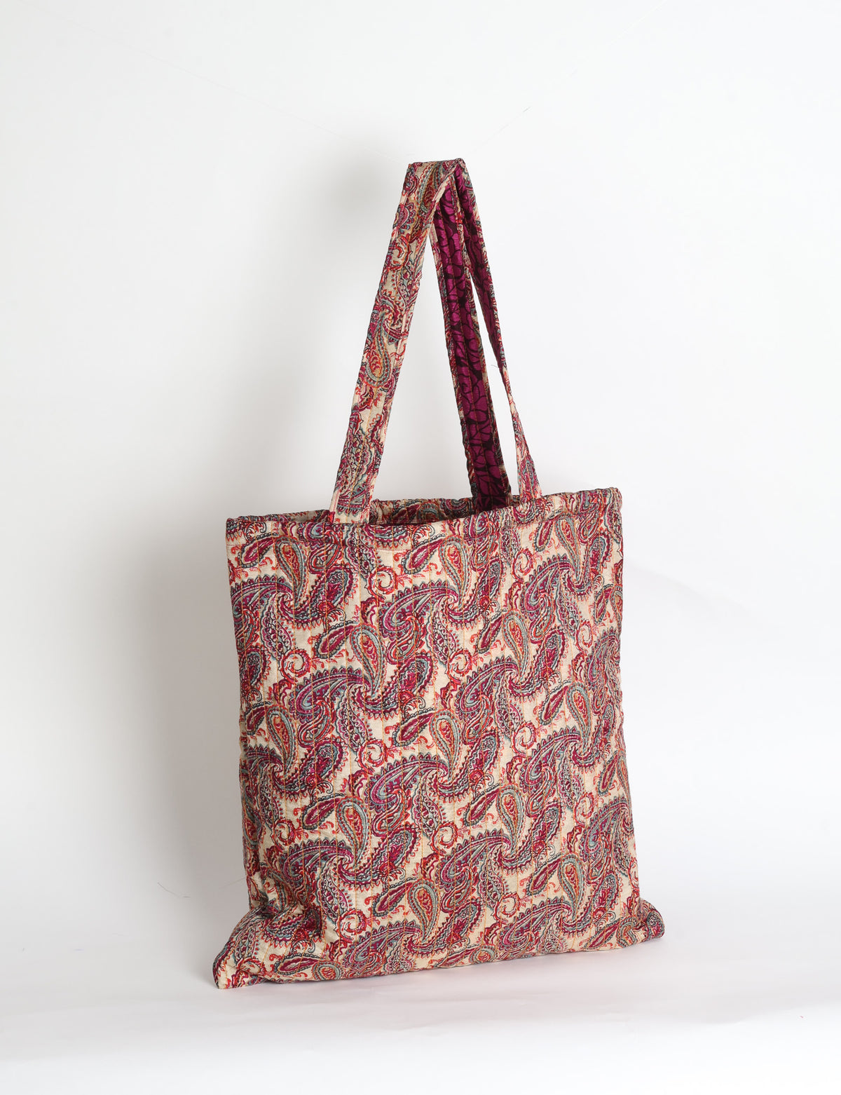 Elevate your style sustainably with our QUILTED SHOPPER BAG. Soft textures, vibrant colors, and a positive impact on people and the planet. Perfect for the office, shopping, or happy hour. Crafted from pre-loved saris for eco-conscious fashionistas!