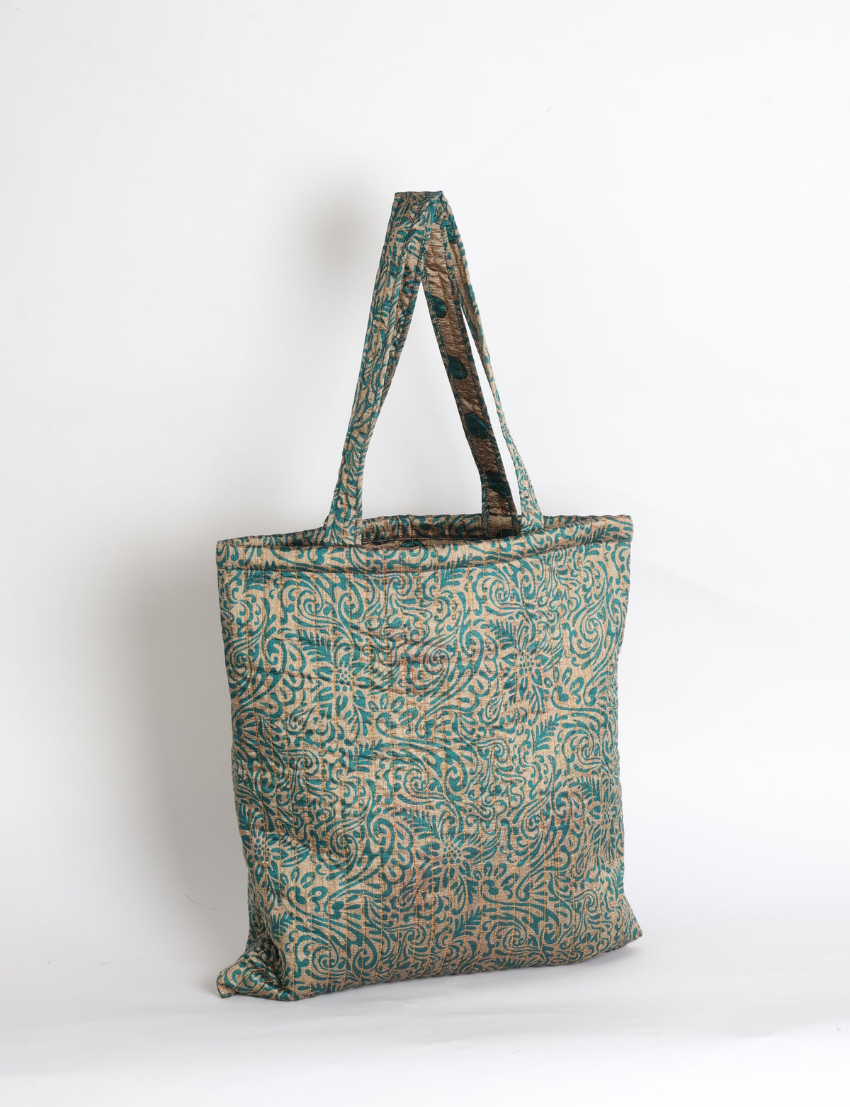 Elevate your style sustainably with our QUILTED SHOPPER BAG. Soft textures, vibrant colors, and a positive impact on people and the planet. Perfect for the office, shopping, or happy hour. Crafted from pre-loved saris for eco-conscious fashionistas!