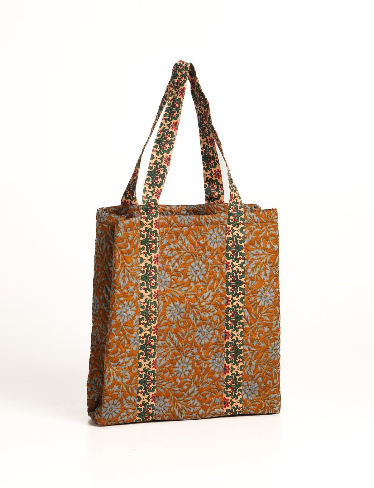 Elevate your style with our Quilted Tote Bag, a perfect fusion of fashion and sustainability. Made from vibrant upcycled saris, the newly quilted design adds strength and softness. With double fabric contrast straps and a unique sari lining, it's a statement of ethical elegance.
