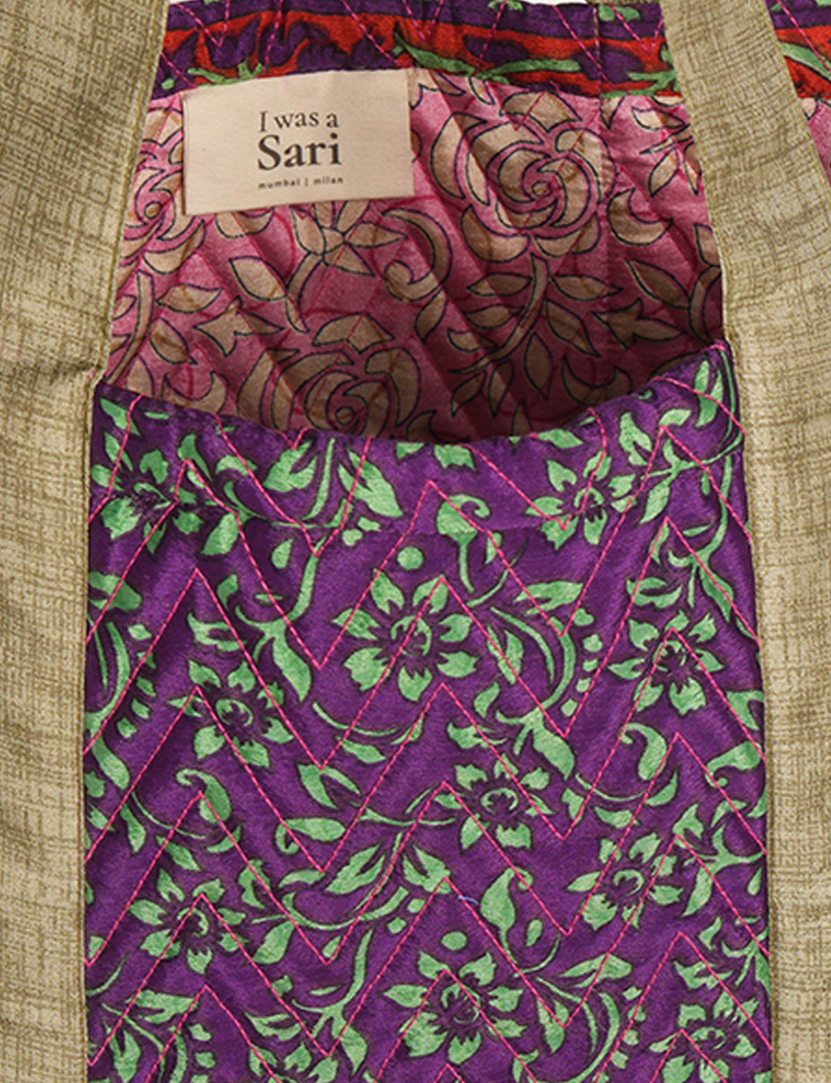Elevate your style with our Quilted Tote Bag, a perfect fusion of fashion and sustainability. Made from vibrant upcycled saris, the newly quilted design adds strength and softness. With double fabric contrast straps and a unique sari lining, it's a statement of ethical elegance.
