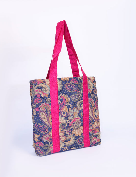 Elevate your style with our Quilted Tote Bag, a perfect fusion of fashion and sustainability. Made from vibrant upcycled saris, the newly quilted design adds strength and softness. With double fabric contrast straps and a unique sari lining, it's a statement of ethical elegance.