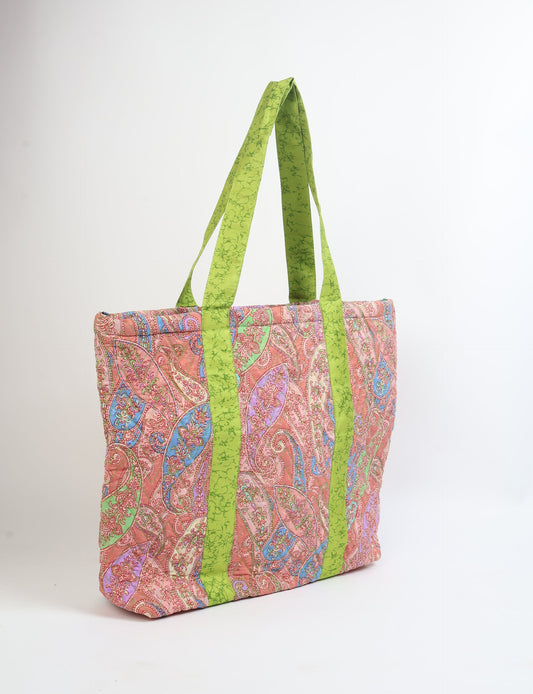 Elevate your style with our Quilted Tote Bag, a perfect fusion of fashion and sustainability. Made from vibrant upcycled saris, the newly quilted design adds strength and softness. With double fabric contrast straps and a unique sari lining, it's a statement of ethical elegance.
