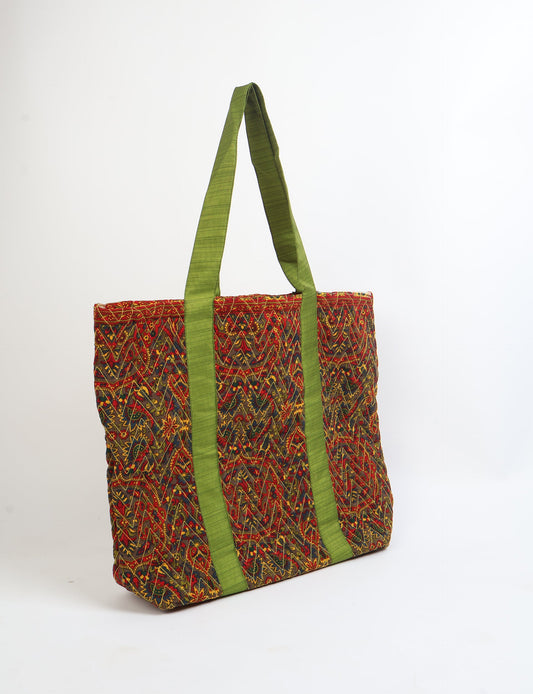 Elevate your style with our Quilted Tote Bag, a perfect fusion of fashion and sustainability. Made from vibrant upcycled saris, the newly quilted design adds strength and softness. With double fabric contrast straps and a unique sari lining, it's a statement of ethical elegance.