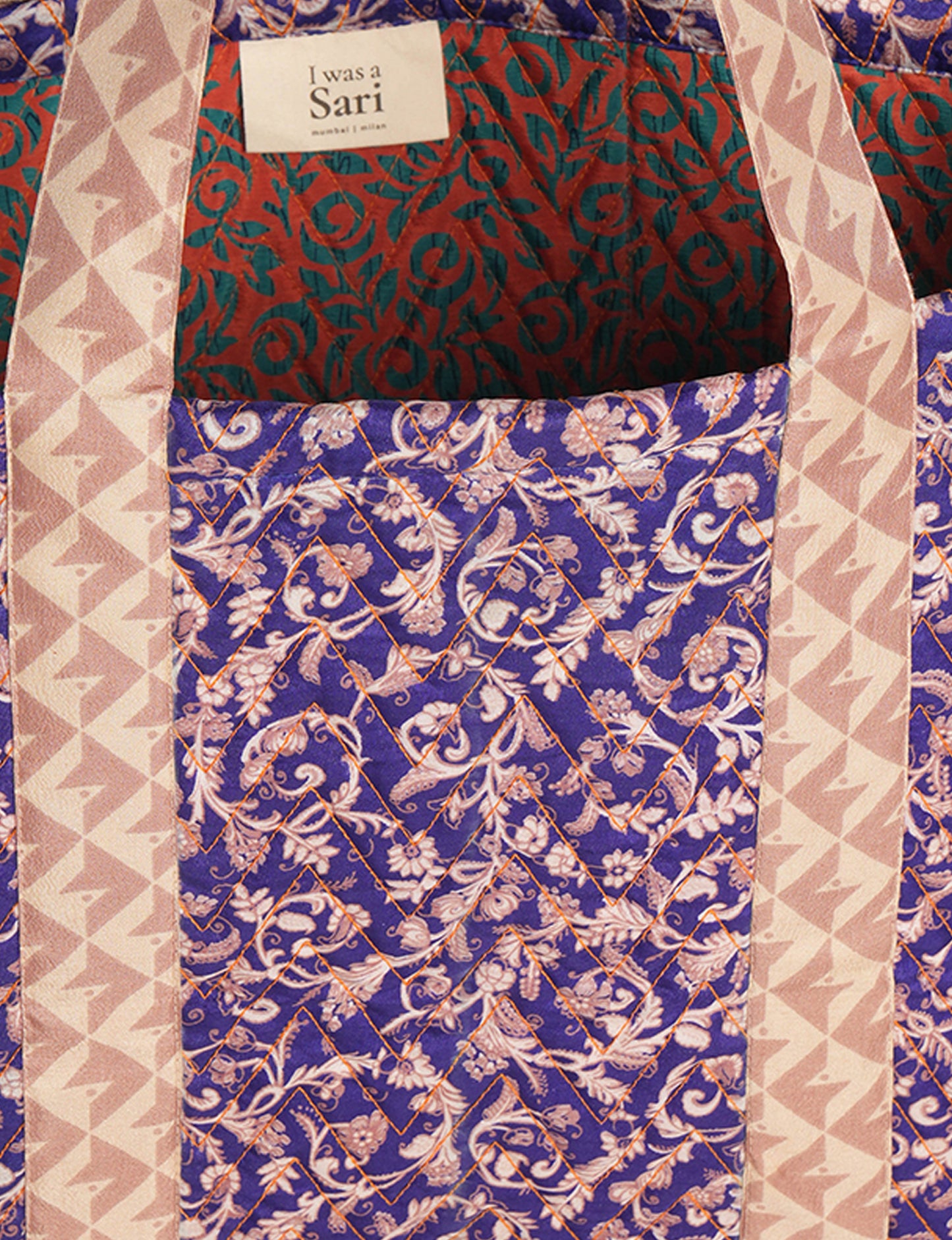 Elevate your style with our Quilted Tote Bag, a perfect fusion of fashion and sustainability. Made from vibrant upcycled saris, the newly quilted design adds strength and softness. With double fabric contrast straps and a unique sari lining, it's a statement of ethical elegance.