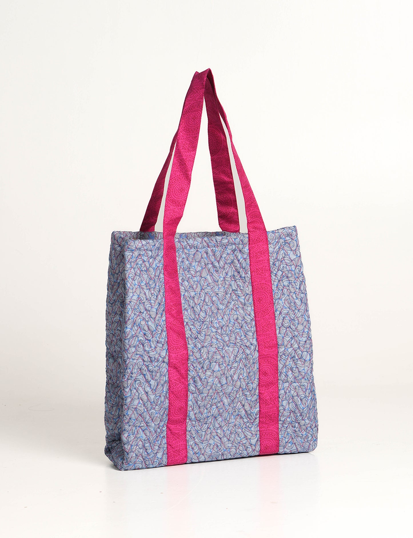 Elevate your style with our Quilted Tote Bag, a perfect fusion of fashion and sustainability. Made from vibrant upcycled saris, the newly quilted design adds strength and softness. With double fabric contrast straps and a unique sari lining, it's a statement of ethical elegance.