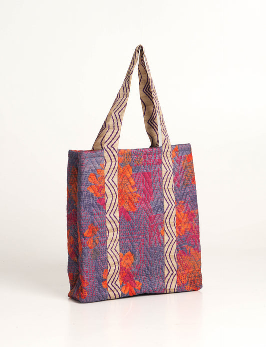 Elevate your style with our Quilted Tote Bag, a perfect fusion of fashion and sustainability. Made from vibrant upcycled saris, the newly quilted design adds strength and softness. With double fabric contrast straps and a unique sari lining, it's a statement of ethical elegance.