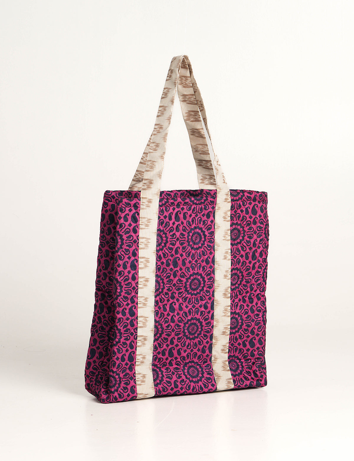 Elevate your style with our Quilted Tote Bag, a perfect fusion of fashion and sustainability. Made from vibrant upcycled saris, the newly quilted design adds strength and softness. With double fabric contrast straps and a unique sari lining, it's a statement of ethical elegance.