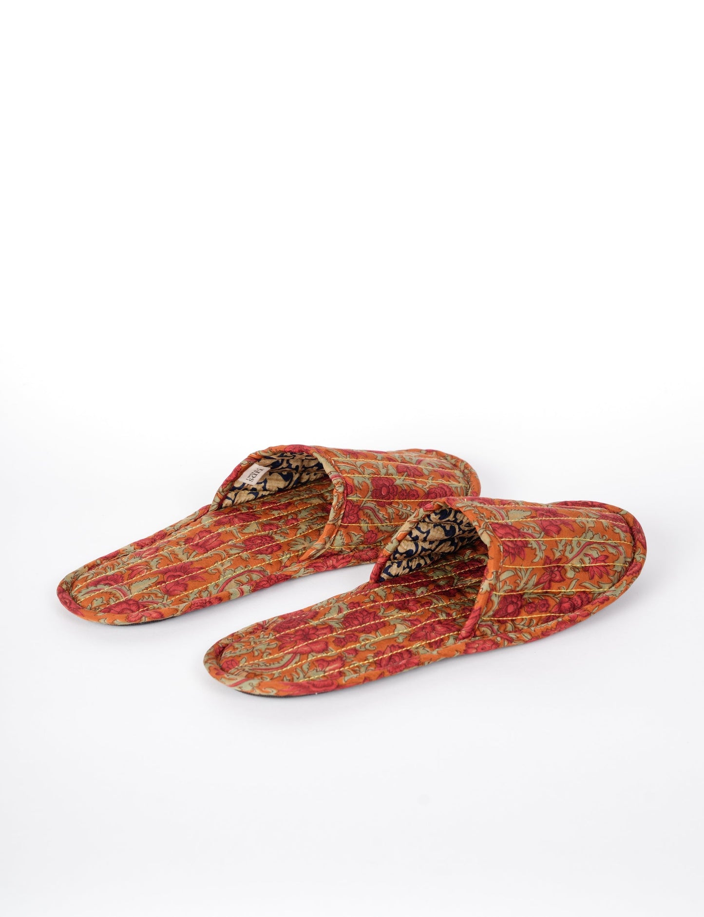 Elevate your downtime with our Quilted Slippers. Ethical, sustainable, and crafted by female artisans in Mumbai, these slippers offer cushioned comfort with a touch of chic style. Warm on the inside, fashionable on the outside, step into sustainable luxury.