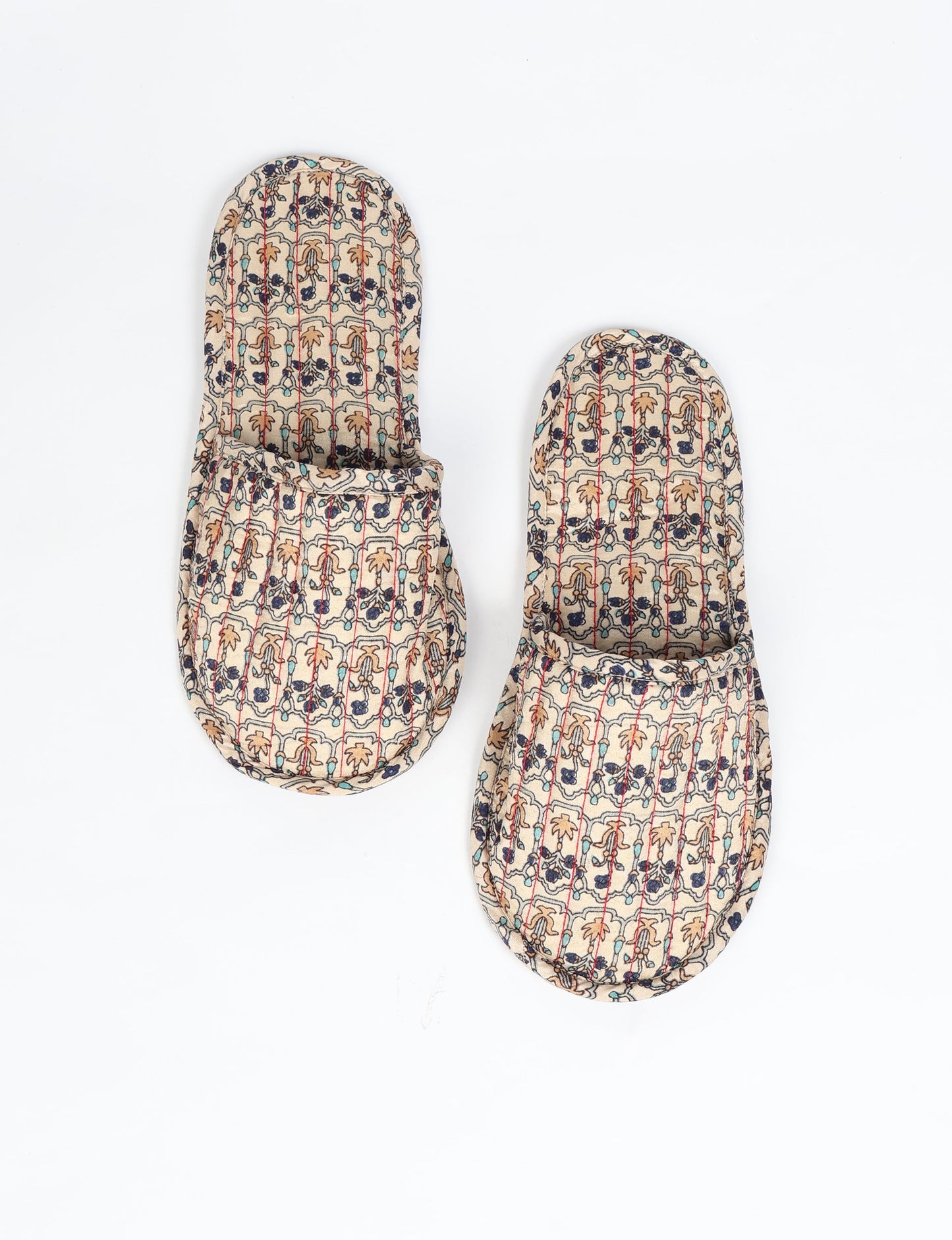 Elevate your downtime with our Quilted Slippers. Ethical, sustainable, and crafted by female artisans in Mumbai, these slippers offer cushioned comfort with a touch of chic style. Warm on the inside, fashionable on the outside, step into sustainable luxury.