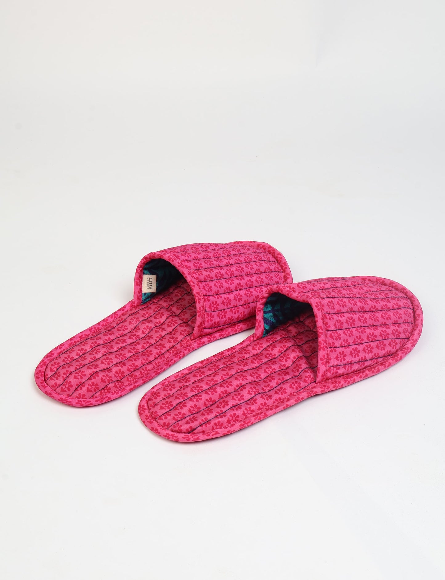 Elevate your downtime with our Quilted Slippers. Ethical, sustainable, and crafted by female artisans in Mumbai, these slippers offer cushioned comfort with a touch of chic style. Warm on the inside, fashionable on the outside, step into sustainable luxury.