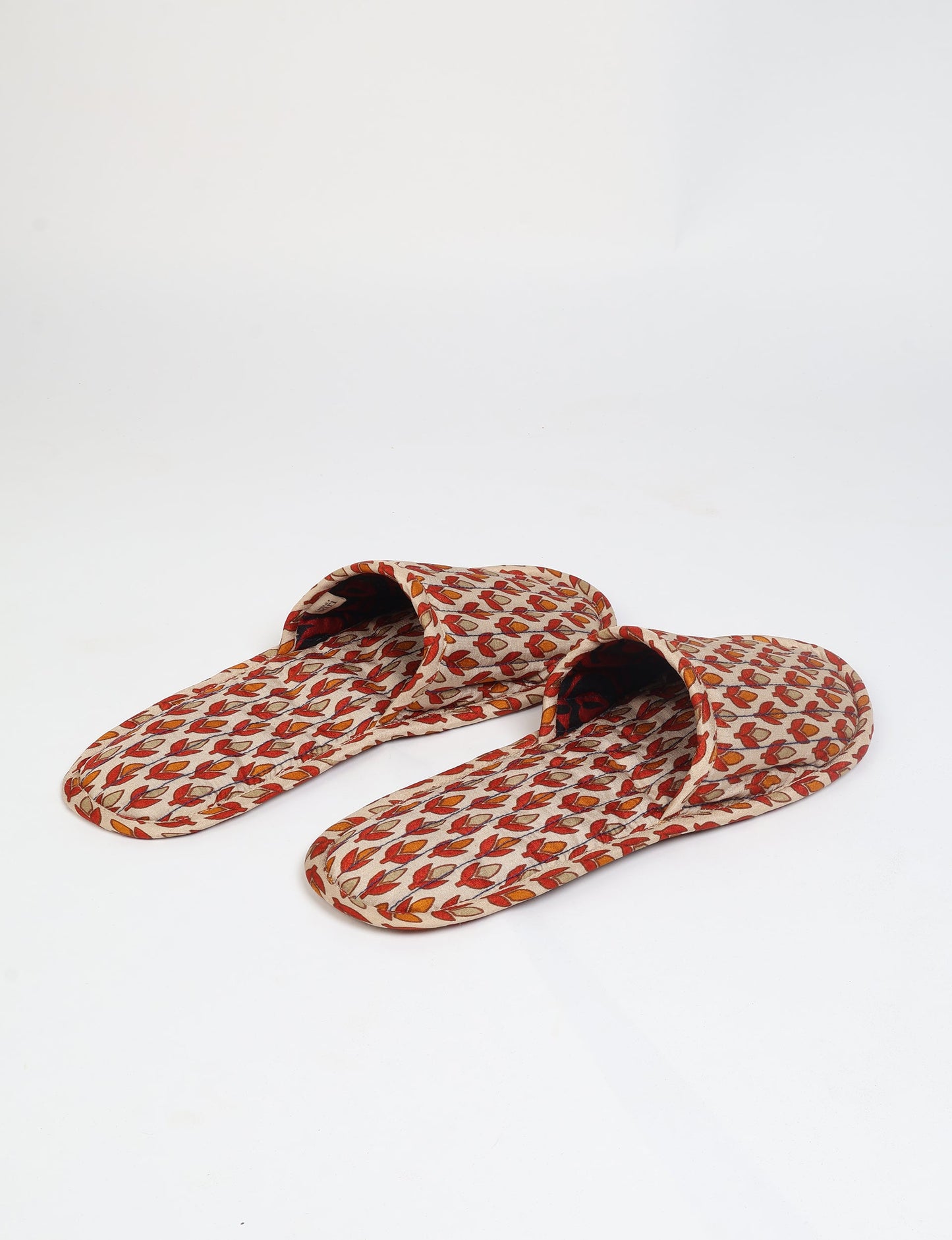 Elevate your downtime with our Quilted Slippers. Ethical, sustainable, and crafted by female artisans in Mumbai, these slippers offer cushioned comfort with a touch of chic style. Warm on the inside, fashionable on the outside, step into sustainable luxury.